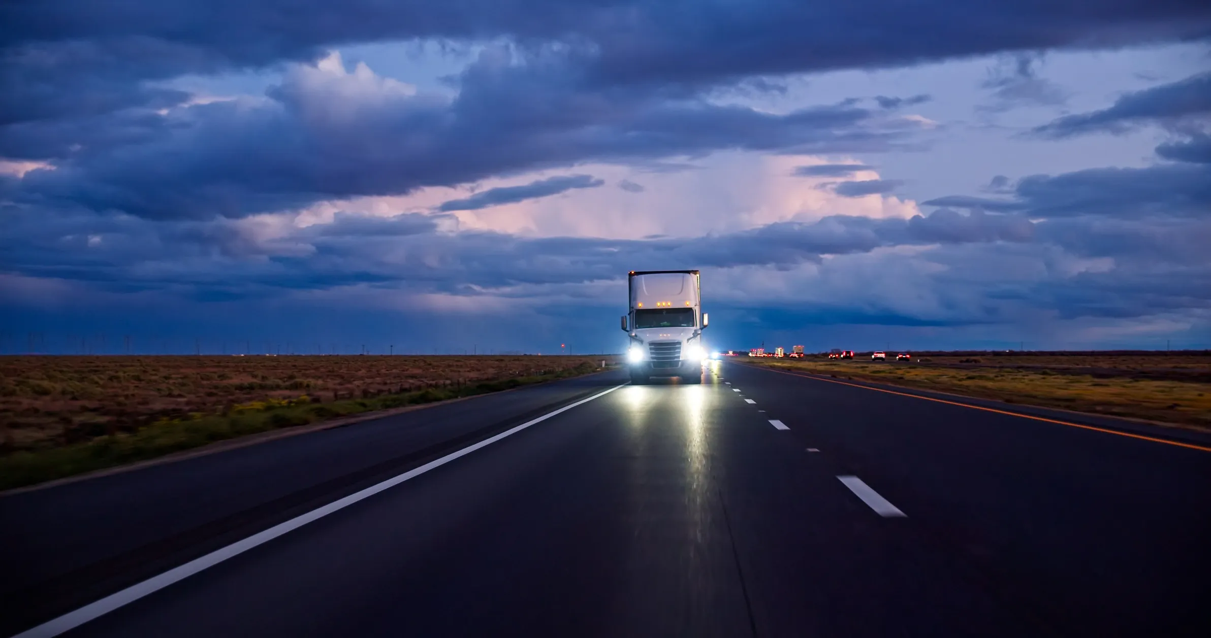 Freight truck on highway at dusk